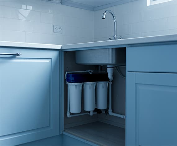 woman filling a glass of water