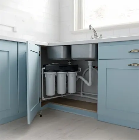 modern kitchen with vibrant blue cabinets and a sleek sink